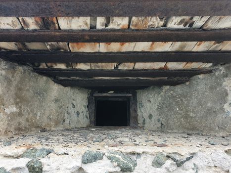 Loophole in concrete wall. Concrete bunker with embrasure.