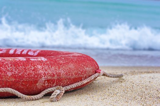 Lifebuoy on the beach. Concept of saving lives