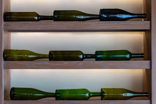 Background of wine bottles in green tones for graphic design or decoration