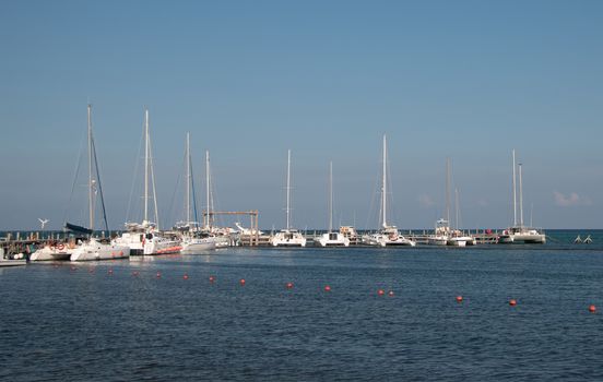 Yachts moored in seaport in beautiful sunny day. Caribbean Sea