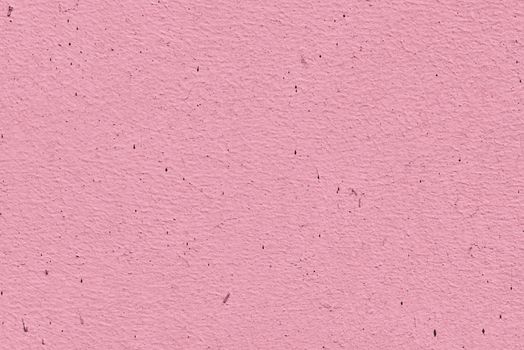 Pink plaster on the wall. Old painted wall. Pink background