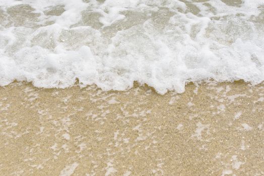 Sea foam on the beach. Sea beach and soft wave