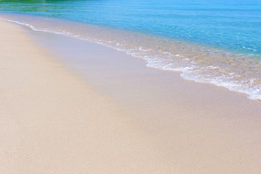 Wave of sea on the beach. Beautiful ocean wave on sandy beach.