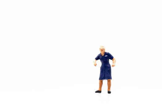 Miniature people standing on white background and space for text