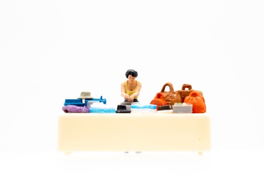 Miniature people standing on white background and space for text