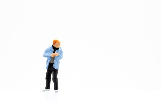 Miniature people standing on white background and space for text