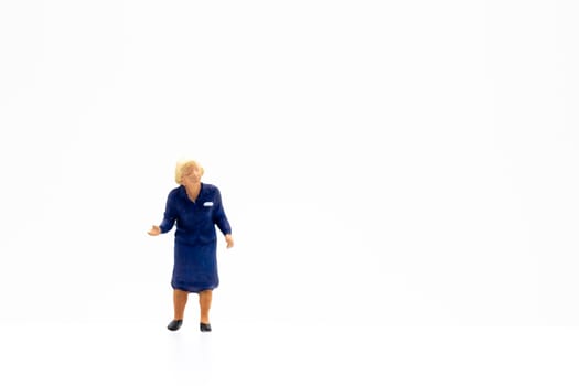 Miniature people standing on white background and space for text