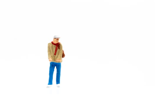 Miniature people standing on white background and space for text