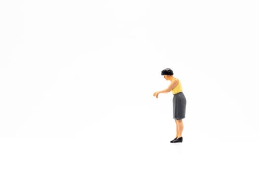 Miniature people standing on white background and space for text