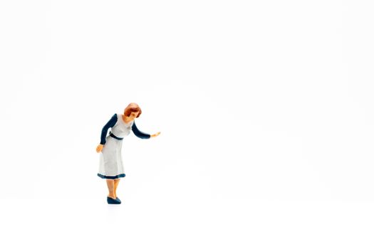 Miniature people standing on white background and space for text