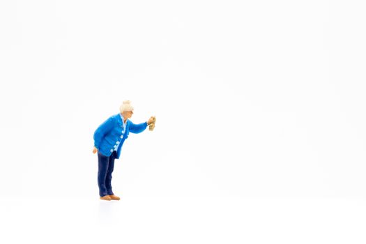 Miniature people standing on white background and space for text