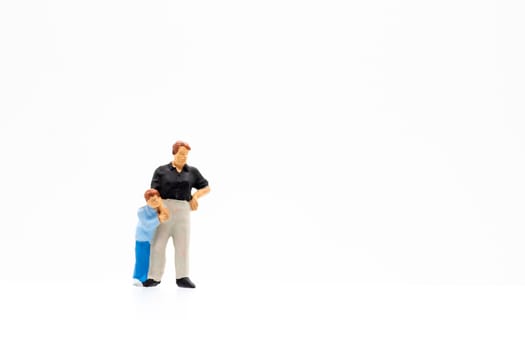 Miniature people standing on white background and space for text