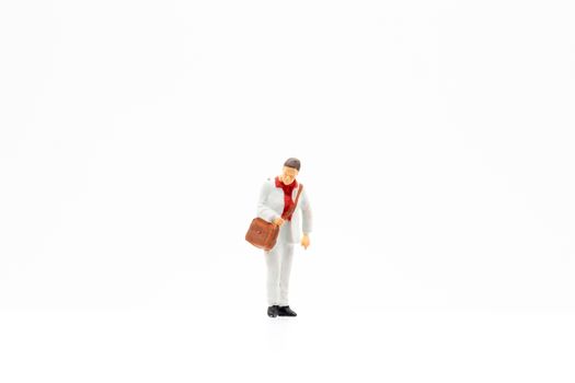 Miniature people standing on white background and space for text