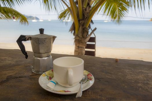 Drinking coffee on the beach in paradise of Koh Phayam, Ranong, Thailand.