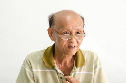 older senior men portrait.Bald Asian men wearing eyeglasses