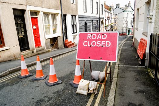 British roadworks with road closed and diverted traffic, signs.