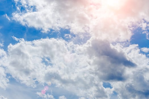 Cloudy sky and bright sun rays making their way through the clouds