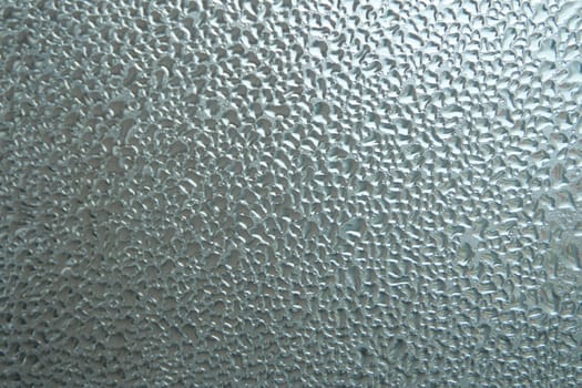 Bright grey color glassy texture, with water drops on it. Water drop glassy background