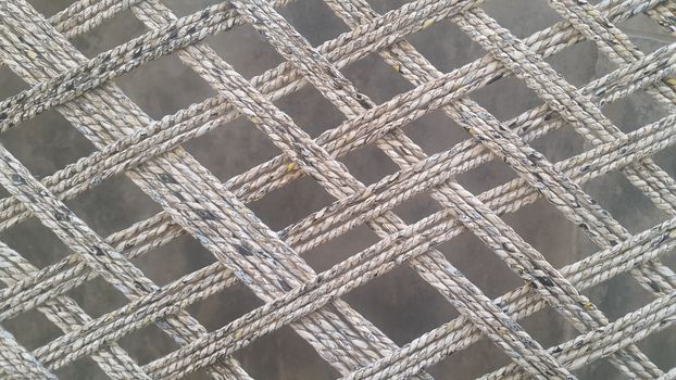 Closeup view of dried jute thread or ropes interwoven for making traditional old style bed called charpai