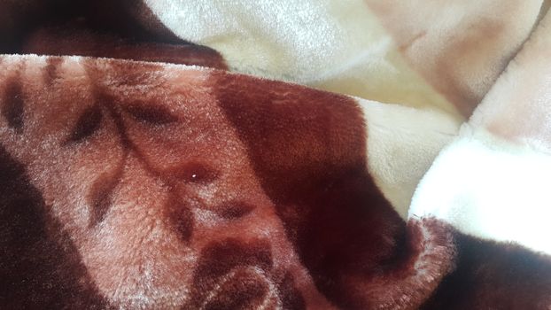 Closeup macro view of colorful soft blanket for winter season