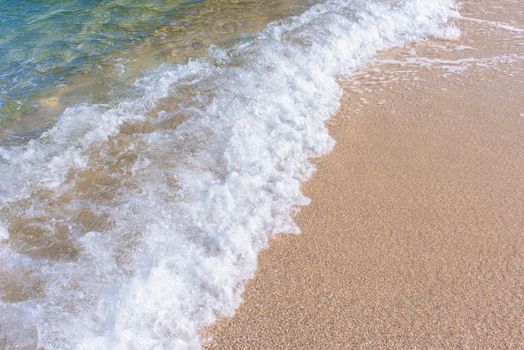 Wave of sea on the beach. Beautiful ocean wave on sandy beach.