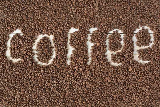 Coffee beans background. Top view of coffee word