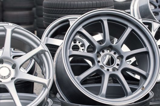 Wheel rims on showcase. Car alloy wheels at a wheel shop