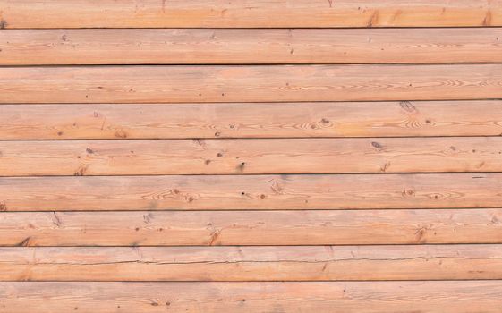 Background of old boards. Wood texture with natural patterns. Wall of planks