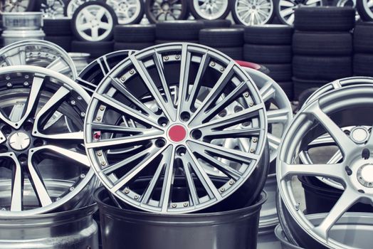 Wheel rims on showcase. Car alloy wheels at a wheel shop