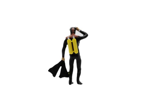 Miniature people : Scuba diver isolated on white background with clipping path