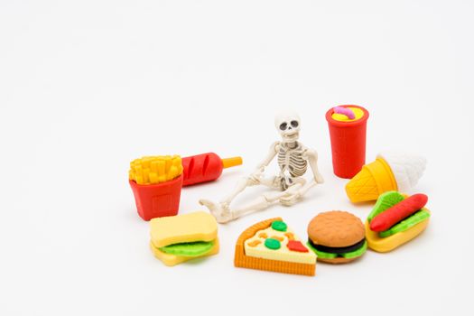 Skeleton and foods, enjoy eating until death with junk foods.