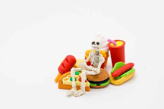 Skeleton and foods, enjoy eating until death with junk foods.
