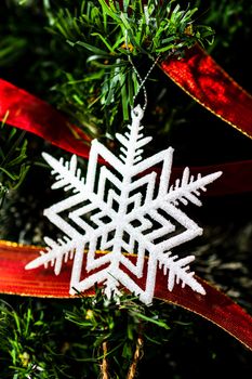 Christmas hanging decorations on fir tree. Decorated Christmas tree. Fir branch with Christmas baubles decorations.