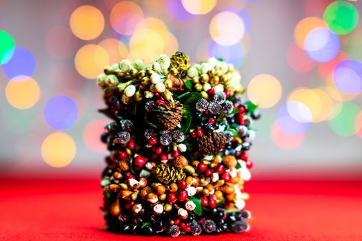 Colorful decorated Christmas wreaths isolated on background of blurred lights.