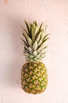 Fresh sweet pineapple on pink textured background, top view copy space