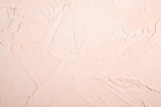 Photo of creative bright textured background in cream peach and white grunge colors, backdrop