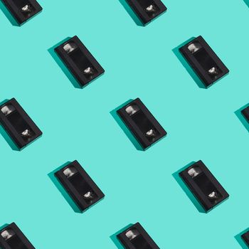 VHS format plastic videotape cassette seamless pattern, analog retro technology magnetic storage tape on minimal mint green background