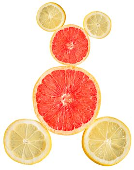 Slices of lemon and grapefruit on a white background making a creative shape 