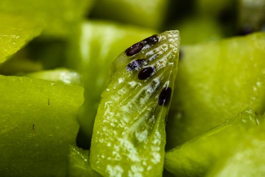 Ripe kiwi fruit. Detail of chopped exotic kiwi fruits used for desserts