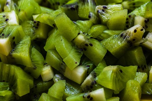 Ripe kiwi fruit. Detail of chopped exotic kiwi fruits used for desserts