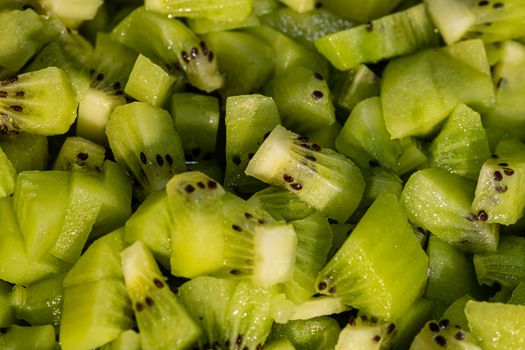 Ripe kiwi fruit. Detail of chopped exotic kiwi fruits used for desserts