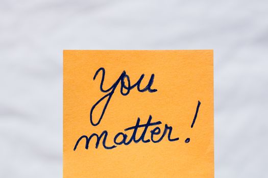 You matter handwriting text close up isolated on orange paper with copy space.