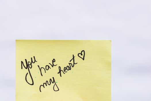 You have my heart handwriting text close up isolated on yellow paper with copy space.