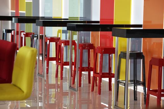 multi-colored bar stools in a colorful interior.