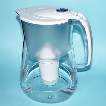 a jug for filtering water on a blue background.