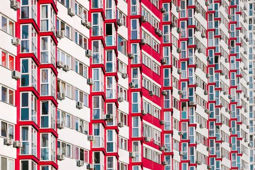 Detail in Modern residential flat apartment building exterior. Fragment of New luxury house and home complex. Part of City Real estate property and condo architecture. Background of real estate market