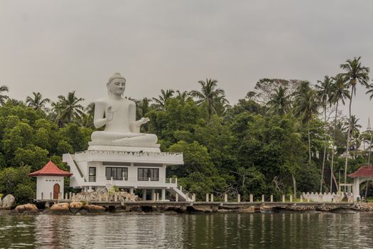 White Udakotuwa Temple in Bentota, Sri Lanka. Huge, white Buddha statue.