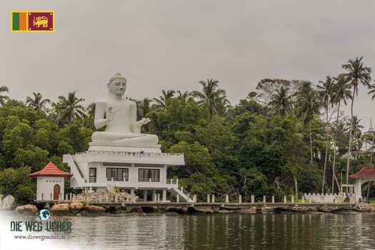 White Udakotuwa Temple in Bentota, Sri Lanka. Huge, white Buddha statue.