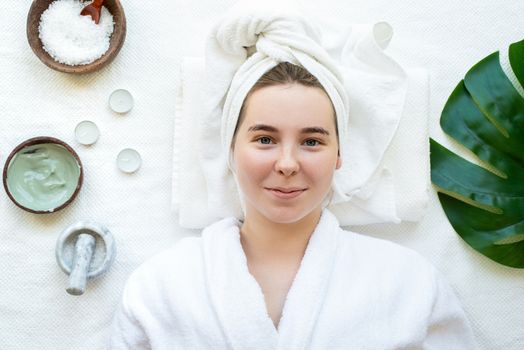 Spa and wellness. Natural cosmetics. Self care. Top view of a relaxed woman having spa procedures using natural cosmetics