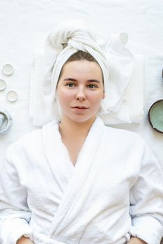 Spa and wellness. Natural cosmetics. Self care. Top view of a relaxed woman having spa procedures using natural cosmetics